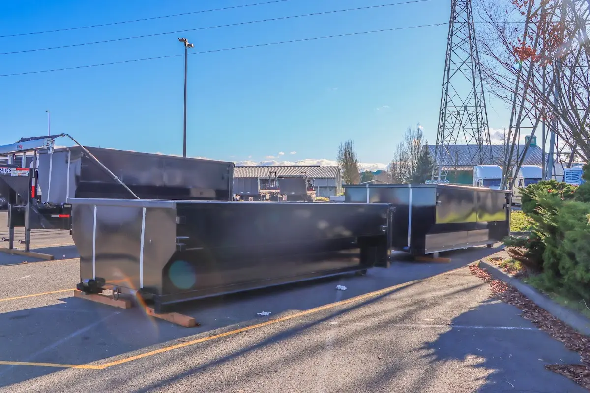 Roll-off dumpster ready for waste disposal at job site for 2 Yard Dumpster Rental in Rosamond